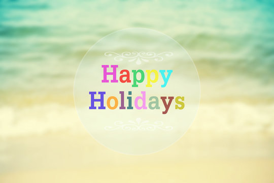 Happy Halidays word on blurred vintage beach abstract background