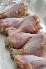 Raw meat. Ready to cook chicken legs. Skinless chicken drumsticks with herbs.