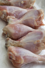 Raw meat. Ready to cook chicken legs. Skinless chicken drumsticks with herbs.