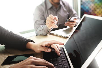 Fototapeta premium two colleague web designer discussing data and digital tablet do