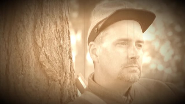Confederate Civil War soldier leans on tree (Archive Footage Version)