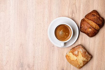 german baps with coffee on wooden