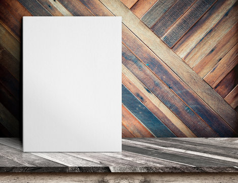 Blank White paper poster on wooden table at diagonal wood plank