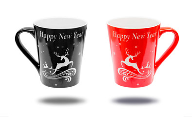 red cup and black cup  with lettering happy new year on white background.