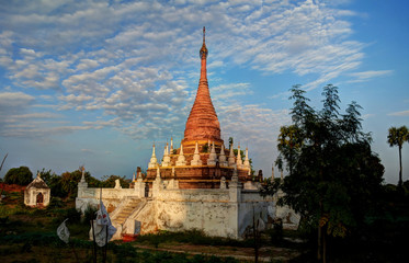 Fototapeta premium Stupa near Maha Aungmye Bonzan temple at sunset, Ava, Myanmar