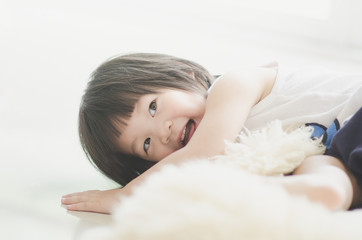 Obraz na płótnie Canvas Closeup photo of cute asian baby's expression