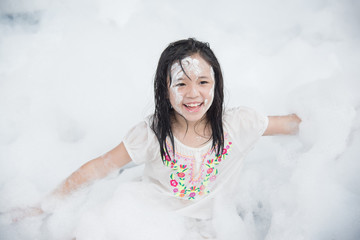 asian girl smiling in foam party