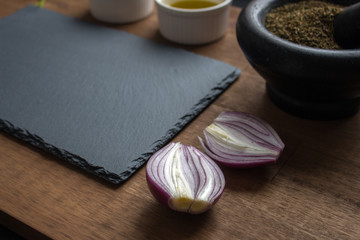 red onion spices stone board