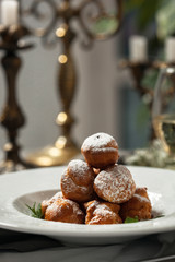 Profiteroles with whipped cream and powdered sugar
