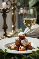 Profiteroles with whipped cream and powdered sugar