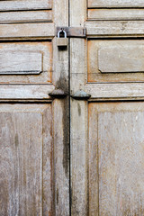 Ancient locks and wooden door abstract texture view