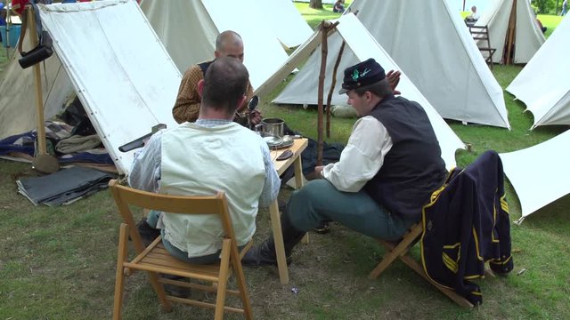 Civil War soldier sitting around the encampment