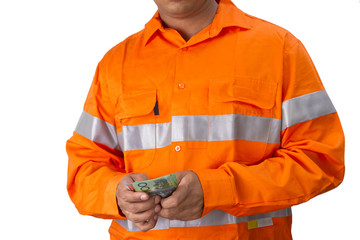 Supervisor or work man with high visibility shirt  holding and countind australian dollar as wages or reward