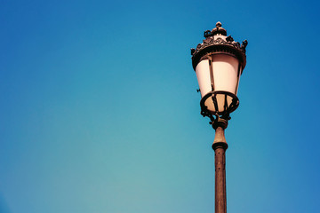 Fototapeta na wymiar Vintage Street Lamp On Blue Sky