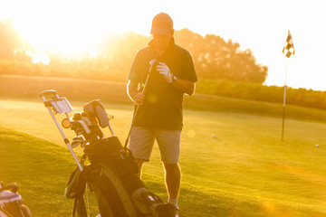 golfer on sunset with flare
