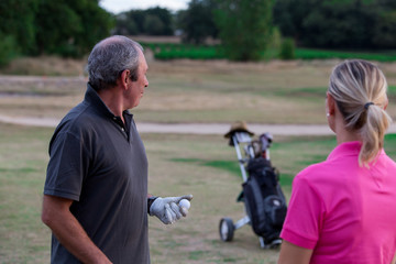 Senior Couple Enjoying Game Of Golf