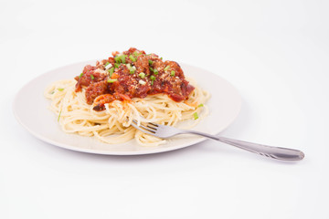 Spaghetti bolognese being eaten with a fork