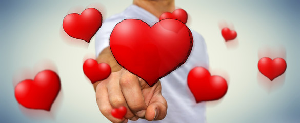 Young man touching hand drawn red heart