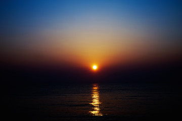blurred sunrise and sea for background