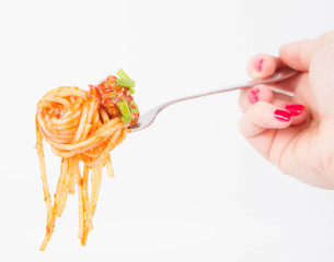 Spaghetti bolognese being eaten with a fork