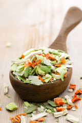 Dried vegetable spice. Bio herbs product. Finely chopped herbs.