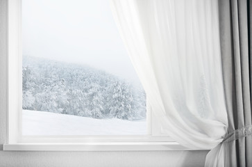 Fototapeta na wymiar Modern residential window with snow landscape