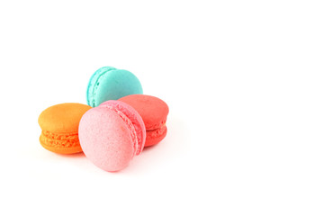 sweet macaroons on white background in soft focus with copy space