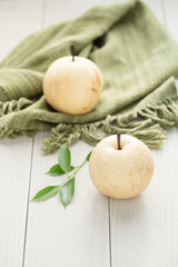 fresh Chinese pears on a wooden table