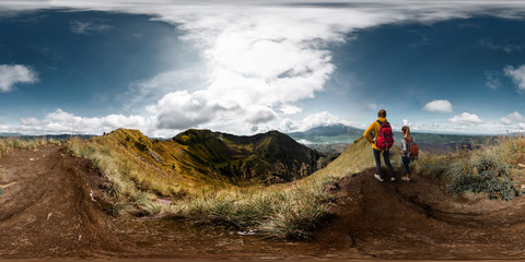 Spherical, 360 degrees, seamless panorama of the two ladies hikers standing on top of the mountain...