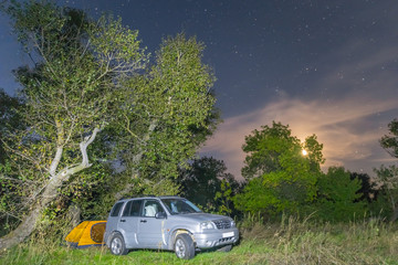 Obraz na płótnie Canvas touristic camp forest glade at the night