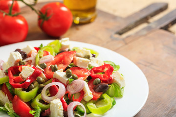 Greek salad on wooden background