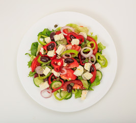Greek salad on white background
