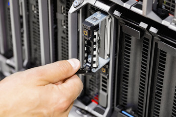Engineer's Hand Working On Server At Data Center