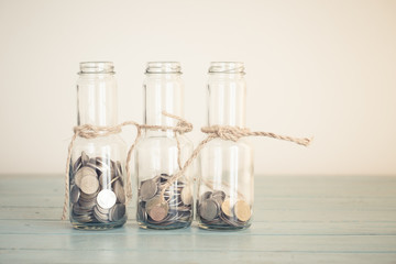 Saving Money in Your Startup,money in the glass with filter effe