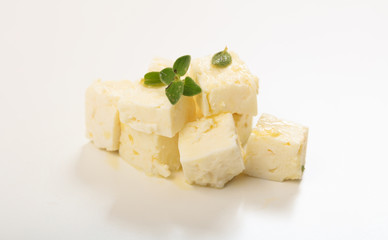 Feta cheece pieces on white background