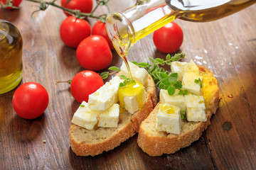 Feta cheece pieces on wooden background
