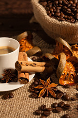 Close-up of coffee cup with cinnamon and star anise