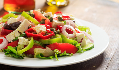 Greek salad on wooden background