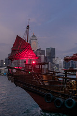 Detail of the sail of a traditional red junk boat in the Victoria harbour