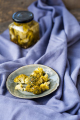 Pickled broccoli in a jar