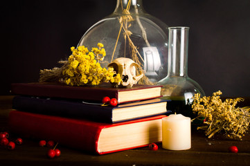 Witches table. Halloween or esoteric concept. On a black background.