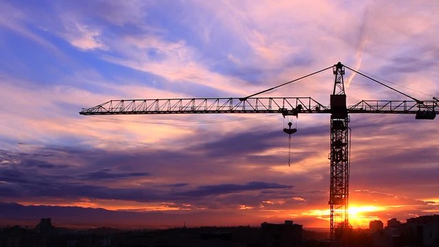 Time lapse of the crane on background of a sunset HD