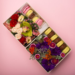 Flowers and macaroons in a hat-box
