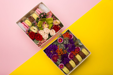 Flowers and macaroons in a hat-box