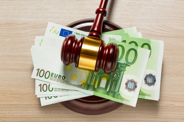 Judge's gavel and one hundred euro banknotes
