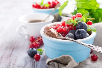 Gordijnen Delicious chocolate dessert with berries and mint served in ramekin. Copy space © Iryna Melnyk