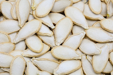 Closeup of dried pumpkin seeds background