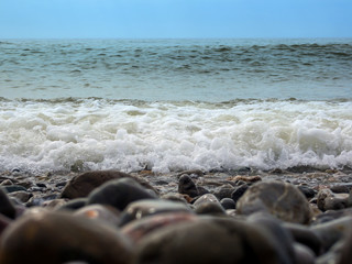 Waves run to the shore pebble beach