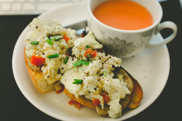 scrambled eggs on bread with milk tea