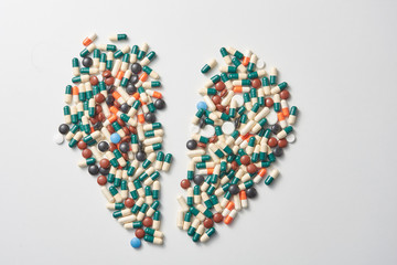 heart made of pills. different colored pills